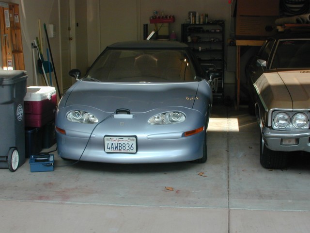 EV1 next to Chevy in garage