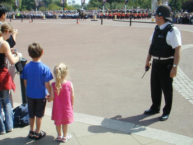Marching band, policeman and children