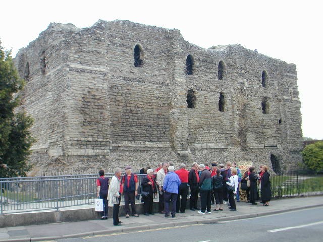Choir members in front of Norman Castle
