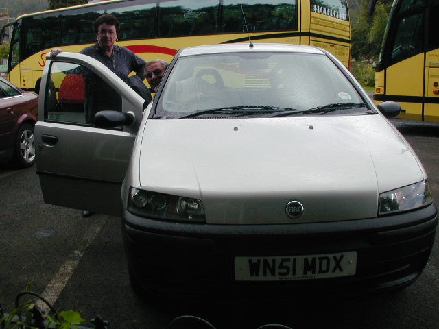 Jim and Sara Sellars with rental car